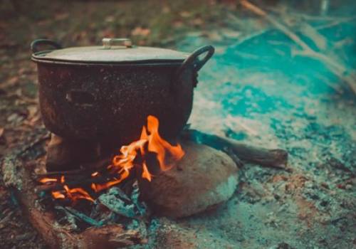 Canoe trip camping meals – Large pot on top of a campfire